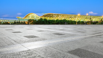 City square floor and airport buildings at night in Shanghai,China.