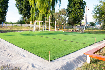 artificial green grass on the playground. plastic lawn