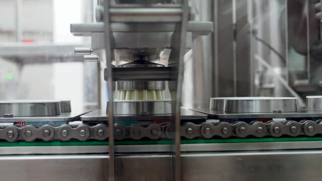 Cloce up. Dairy food production sour cream automated line
