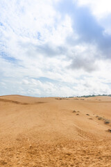 Fototapeta na wymiar Red Sand Dunes, also known as Golden Sand Dunes, is located near Hon Rom beach, Mui Ne, Phan Thiet city.
