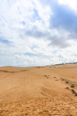Fototapeta na wymiar Red Sand Dunes, also known as Golden Sand Dunes, is located near Hon Rom beach, Mui Ne, Phan Thiet city.