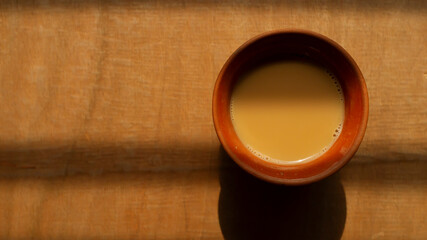 Traditional Indian Tea on a clay tea cup top view 