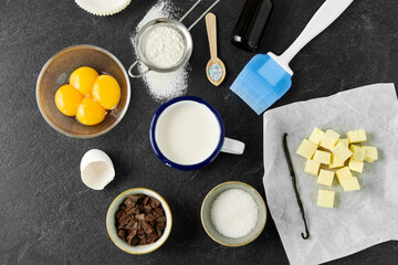 food, culinary and recipe concept - baking and cooking ingredients on table
