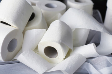Toilet paper in a roll. Snow-white soft three-layer toilet paper. Lack of hygiene products. Primary protection and disinfection.