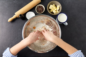 food cooking, baking and culinary concept - hands making shortcrust pastry at bakery