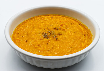 Carrot cream soup (vellutata di carote) isolated on white background