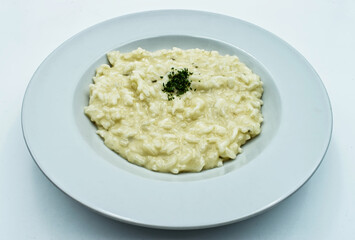 Risotto with cheese (risotto alla parmigiana) isolated on white background