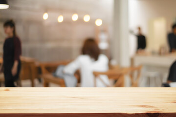 cofee shop blurred background with wooden desk space montage.