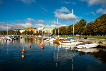 Fototapeta na wymiar Nice finnish harbor with yachts during sunny autumn day.