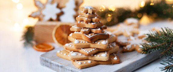 Fir tree made of delicious homemade gingerbread cookies decorated with icing. Rustic decor,...