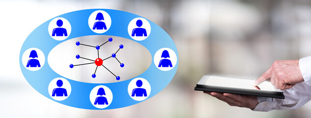 Social network concept with man using a tablet