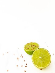 Bright juicy sour lime on a white background cut in half.