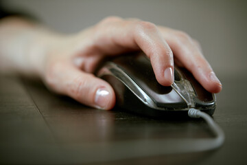 close up of businesswoman using computer mouse