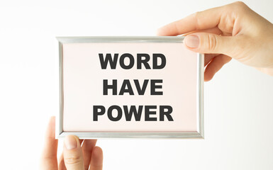 Naklejka na ściany i meble hand holding white card written words have power over blur background
