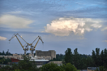 Fototapeta na wymiar abandoned ship and ship building cranes in Mykolaiv Ukraine.