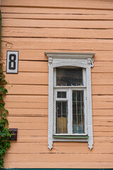 Fototapeta na wymiar wooden window in the wall of a wooden house