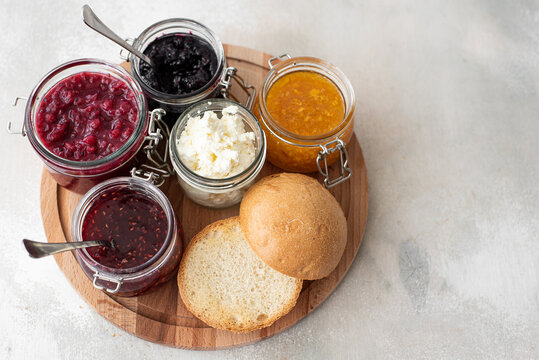 homemade berry jam with round bun and cheese