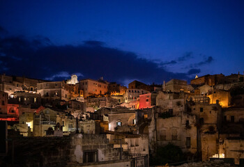 Fototapeta na wymiar Night landscape of the Sassi of Matera a historic district iin the city of Matera well-known for their ancient cave dwellings. Basilicata. Italy