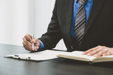 Picture of the male lawyer is providing service to consult business dispute