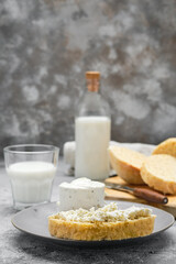 Healthy breakfast with homemade yeast-free bread, soft cheese and milk