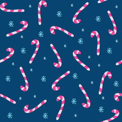 Vector seamless pattern with candy canes, snowflakes on a dark blue background. Christmas and winter theme. Great for fabrics, wrapping papers, wallpapers, covers.