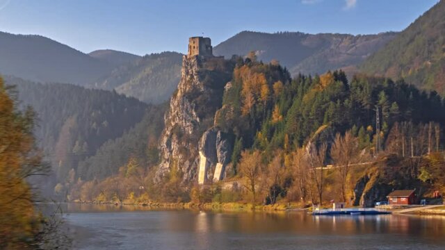 Abandoned clifftop Strecno castle on Vag river hyper lapse at clear autumn morning, Slovakia.