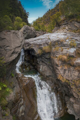 Fototapeta na wymiar Alpine panorama with turquoise waterfall