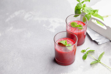 Homemade strawberry mousse dessert with fresh mint on light background
