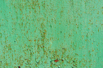 texture of metal covered with rust and old green paint. rough iron background