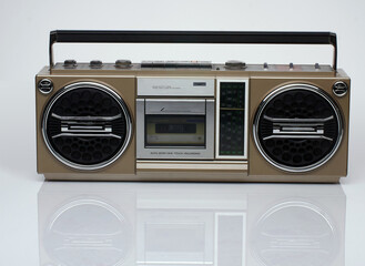 Vintage boom box on white background with reflection