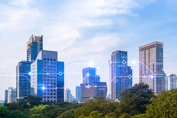 Obraz premium Technology hologram over panorama city view of Bangkok. The largest tech hub in Asia. The concept of developing coding and high-tech science. Double exposure.