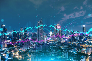 Fototapeta premium FOREX graph hologram, aerial night panoramic cityscape of Bangkok, the developed location for stock market researchers in Asia. The concept of fundamental analysis. Double exposure.