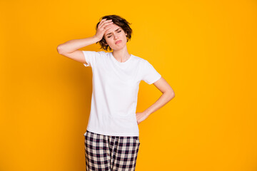 Fototapeta premium I better go sleep. Portrait of frustrated sad upset girl feel exhausted suffer migraine touch hand forehead wear good look pyjama isolated over vivid color background