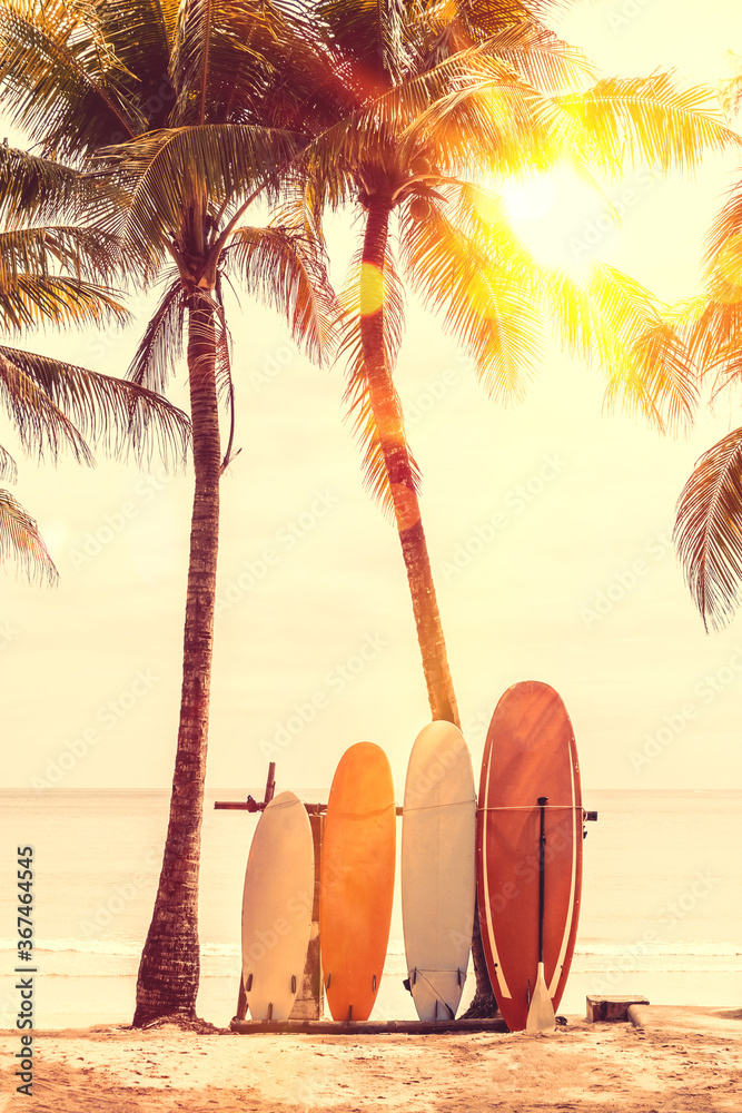 Canvas Prints surfboard and palm tree on beach background.