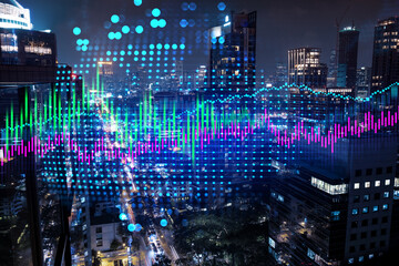 Stock market graph hologram, night panorama city view of Bangkok, popular location to gain financial education in Asia. The concept of international research. Double exposure.