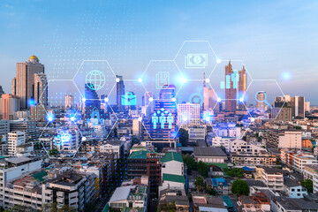 Fototapeta premium Hologram of Research and Development glowing icons. Sunset panoramic city view of Bangkok. Concept of innovative technologies to create new services and products in Asia. Double exposure.