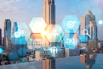 Hologram of Research and Development glowing icons. Sunset panoramic city view of Bangkok. Concept of innovative technologies to create new services and products in Asia. Double exposure.