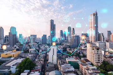 Hologram of Research and Development glowing icons. Sunset panoramic city view of Bangkok. Concept of innovative technologies to create new services and products in Asia. Double exposure.