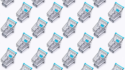 Metal shopping cart (toy) cloned on white background. Background pattern. © Kot63