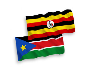 Flags of Republic of South Sudan and Uganda on a white background