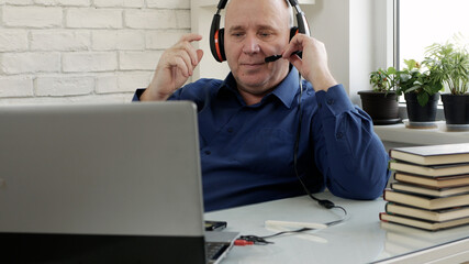 Man Working from Home Talking in a Video Call Using Laptop Connection