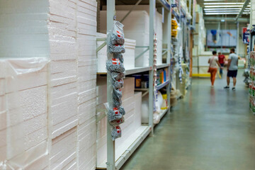 Modern warehouse with goods for construction and renovation on shelves . Blurred, focus with shallow depth of field and bokeh.