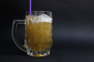 mug of beer on a dark background with nuts
