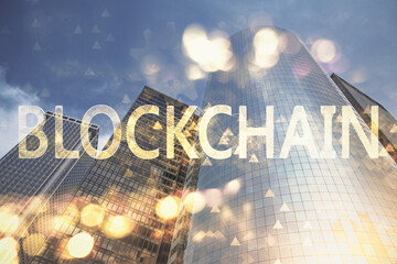 Double exposure of crypto currency theme hologram drawing and city veiw background. Concept of...