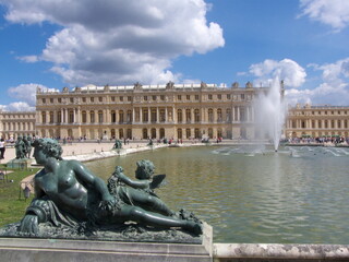 Fototapeta na wymiar Versailles, France, the palace of Versailles with a beautiful garden in front of facade with a lot of fountains and statues