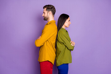 Profile photo cool lady handsome guy standing back-to-back arms crossed confident partners team look empty space wear casual bright shirts outfit isolated purple color background