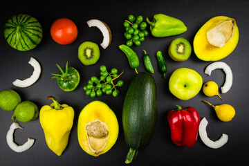 Vegetables and fruits on a black background