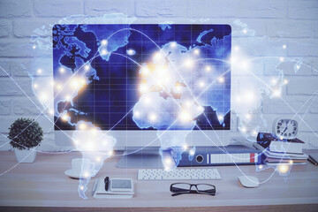 Double exposure of business theme icons and work space with computer background. Concept of success.