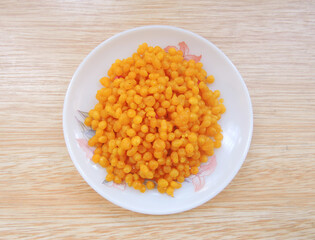 An Indian dessert made from sweetened, fried chickpea flour called Boondi in local language in India. Boondi is considered an important recipe in Hindu culture as it is distruted during festivals. 