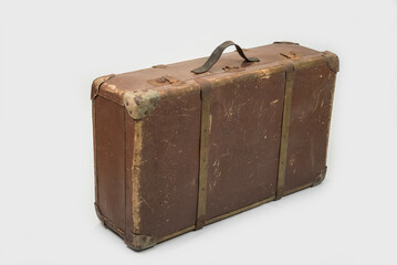 Old brown retro suitcase on a white background